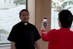 Cathedral of Our Lady of the Angels pastor Fr. David Gallardo tapes a video message for the 