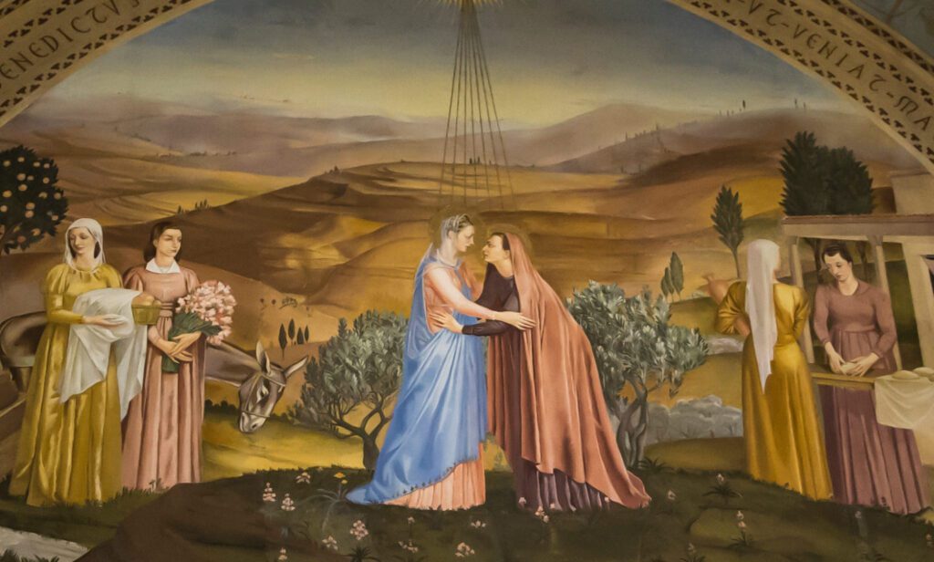 La visita de la Santísima Virgen María a su prima Isabel está representada en una pintura mural en la Iglesia de la Visitación en Ein Karem, Jerusalén. (Shutterstock)