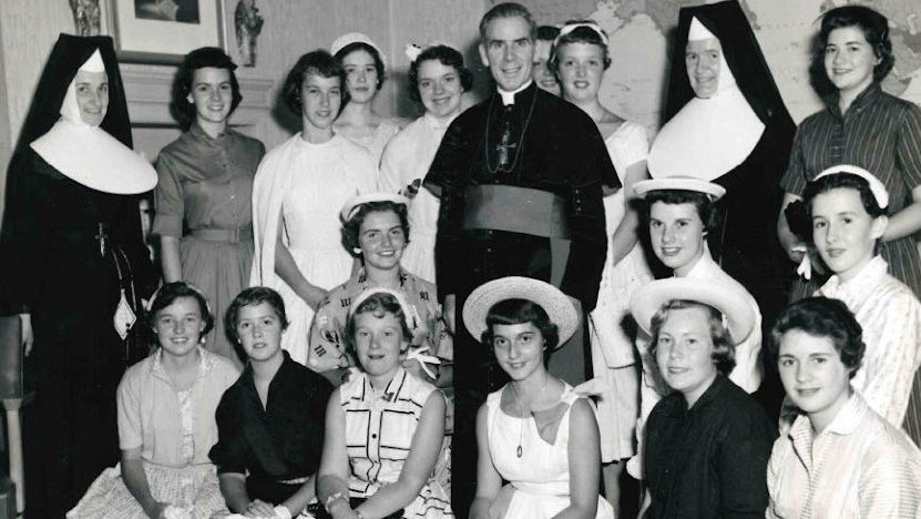 Archbishop Fulton J. Sheen is seen in an undated photo posing with women who worked at the Society for the Propagation of the Faith in New York City. (OSV News photo/Pontifical Mission Societies USA Archives)