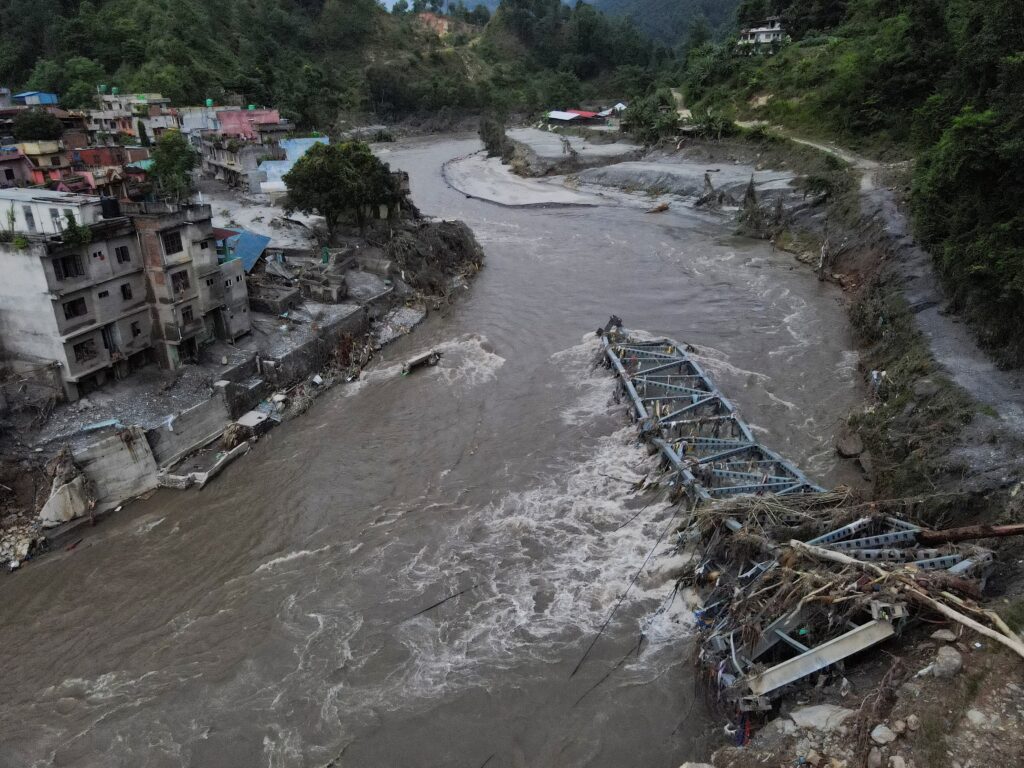 A drone view of a broken bridge and damaged houses after the flash floods and mudslide, at Devighat, Nuwakot district, Nepal, Aug. 28, 2026. (OSV News photo/Francis Mascarenhas, Reuters)