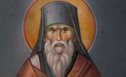 Icon of a saint with a golden halo, long white beard, and dark head covering.