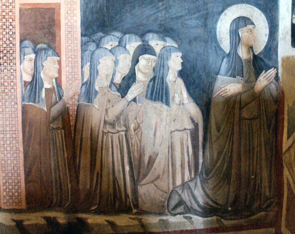 Fresco de santa Clara y las hermanas de su orden, iglesia de San Damián, Asís. (Wikipedia)