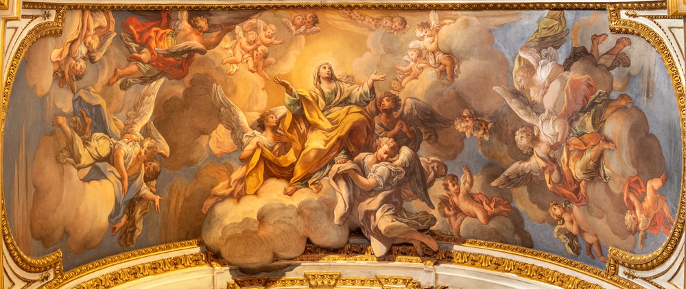 Baroque ceiling fresco with a central figure in yellow robes on clouds, surrounded by angels and cherubs in flight.